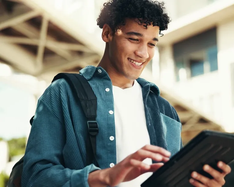 carousel-young-man-using-tablet-outdoors