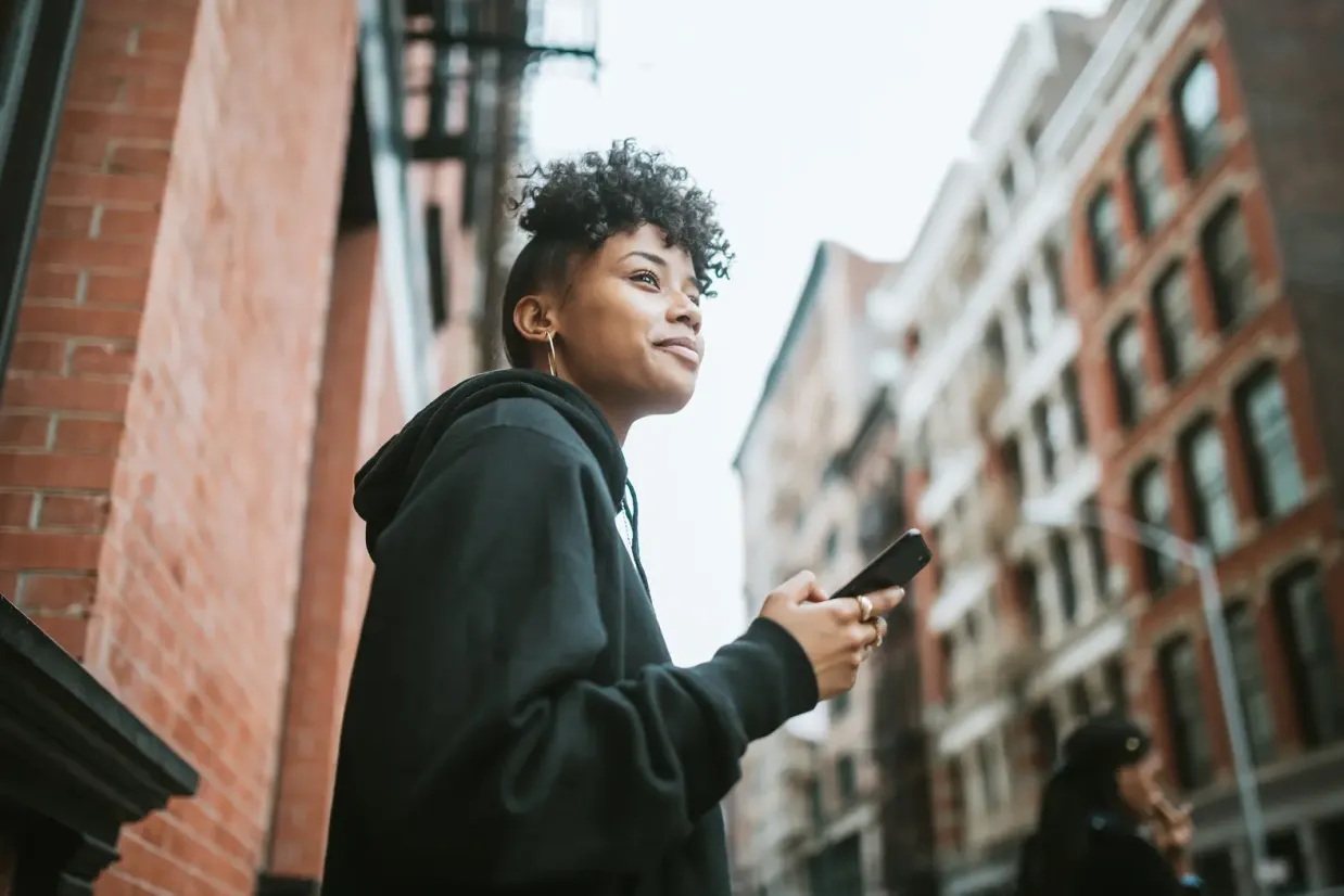 young-man-headphones-phone-city-street