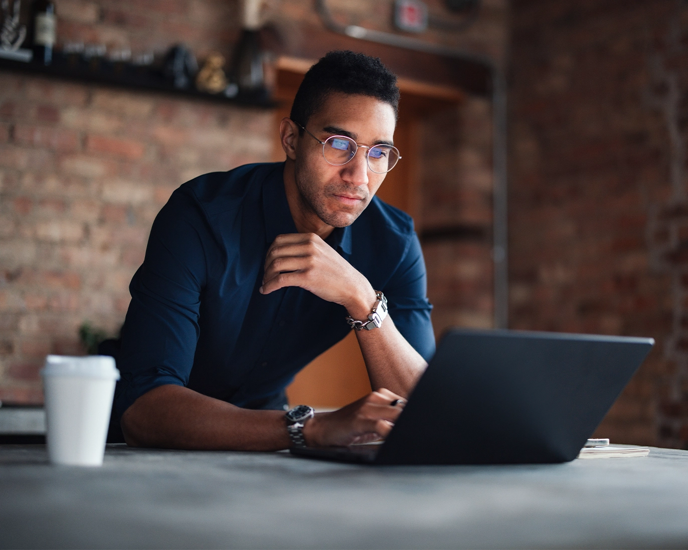 young-man-online-ielts-study-laptop-cafe