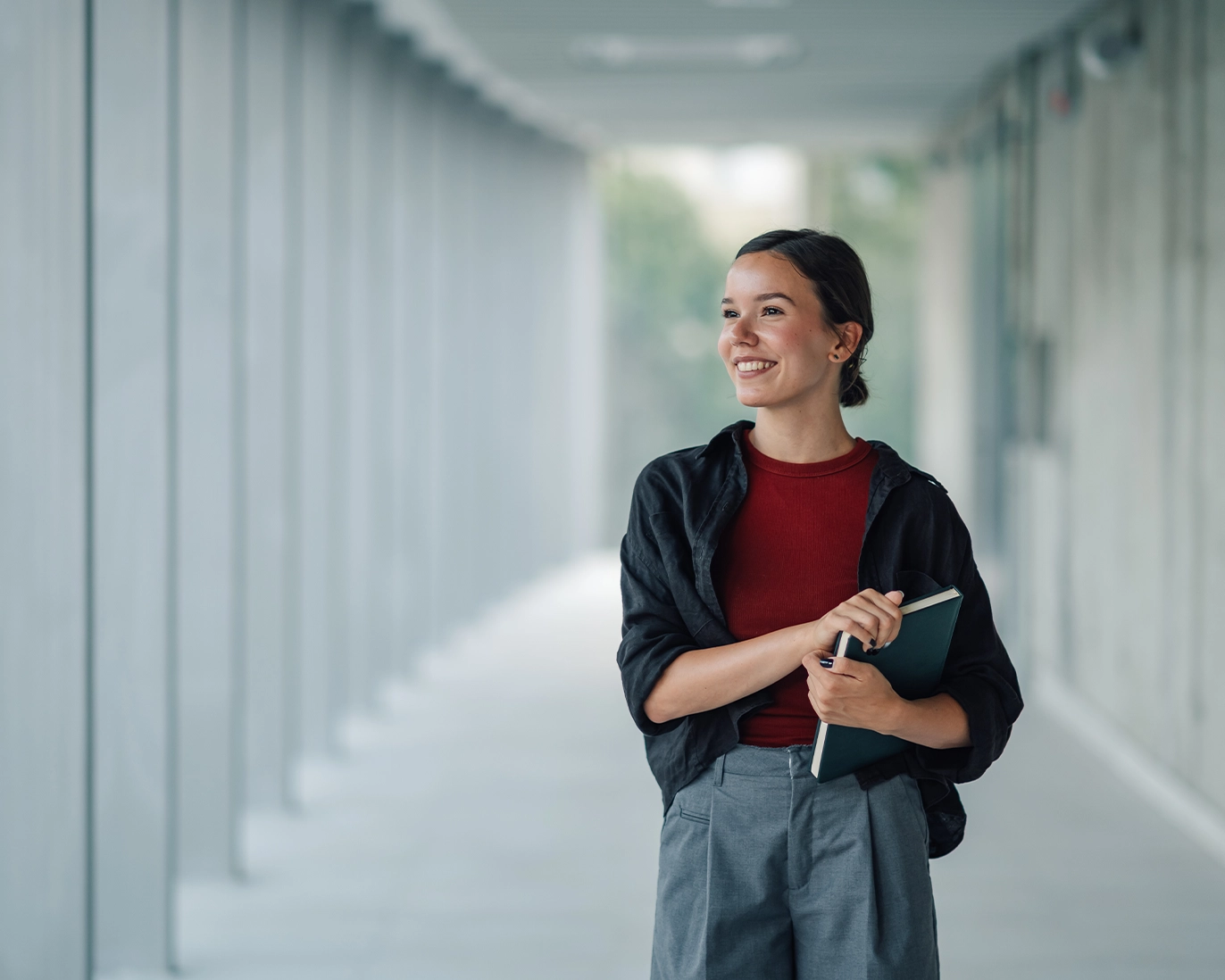 young-woman-ielts-study-materials-modern-hallway