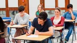 a group of students taking an ielts test