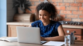 young woman looking at her latop