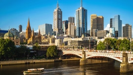 A city view with buildings and a bridge over a river in Australia