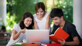 Students reading in front of the computer 