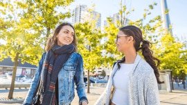 Two girls walk in the streets of Toronto