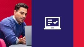 a man looking at a laptop