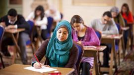 People taking an English proficiency test in a test centre