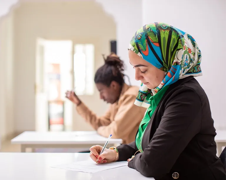 Test takers giving IELTS exam