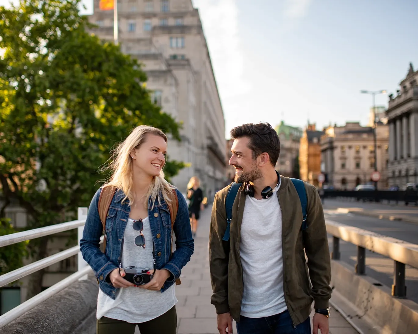Two students walking and talking happily after giving IELTS exam