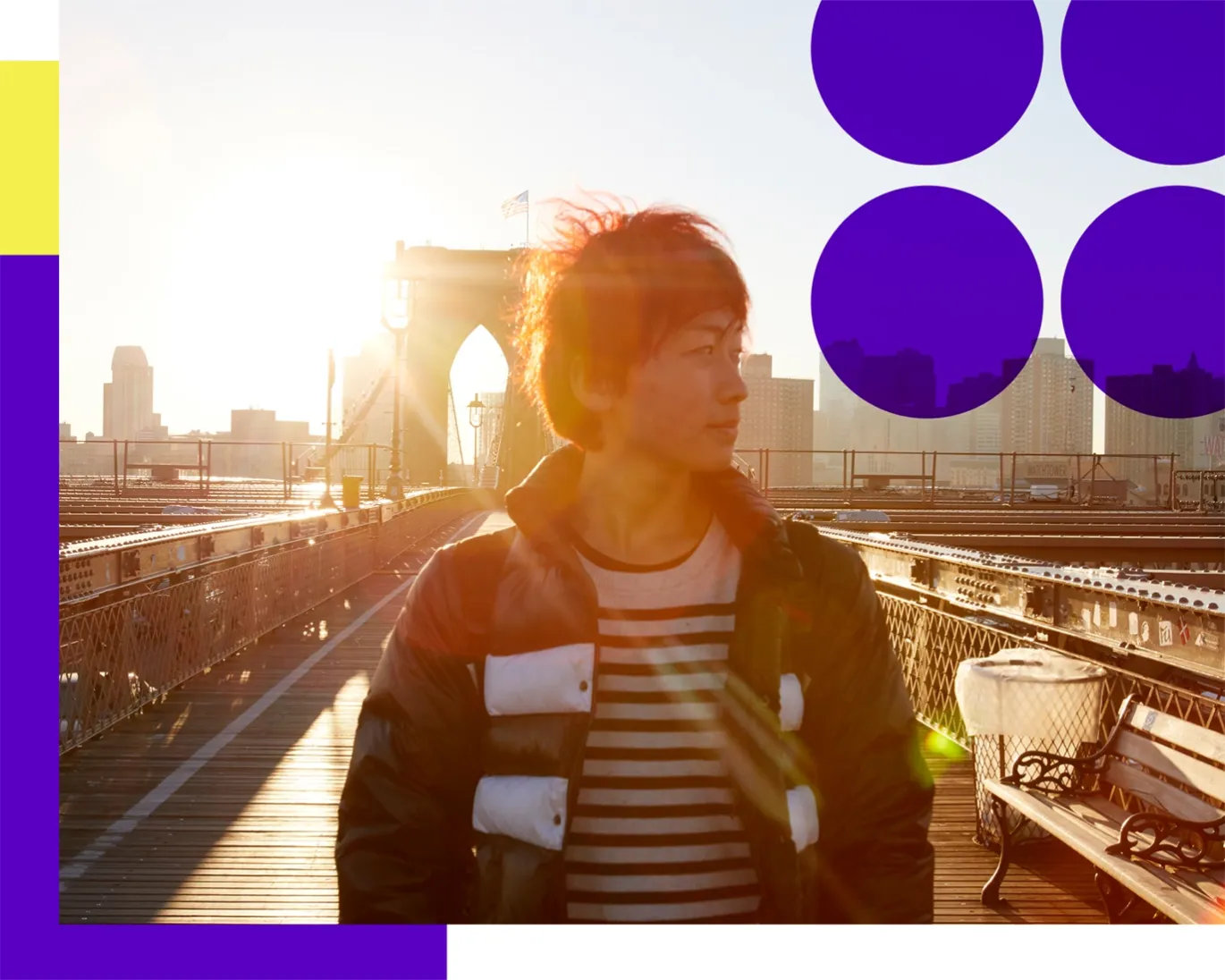 Young person standing on a city bridge during sunset