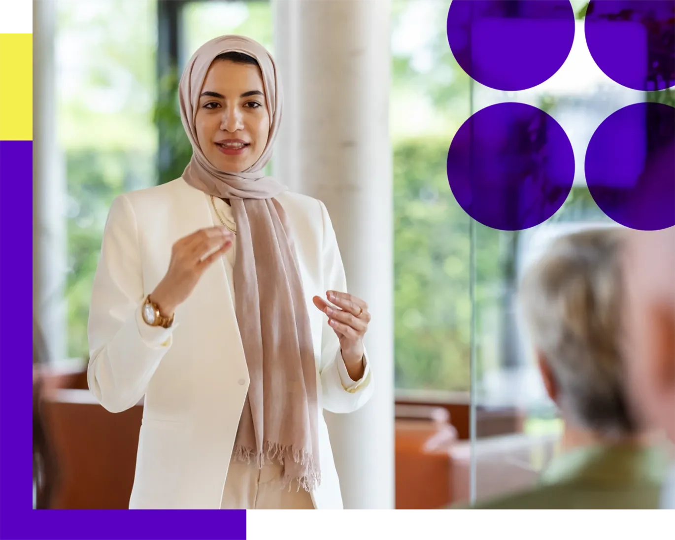 Woman giving an IELTS counseling or presentation session indoors.