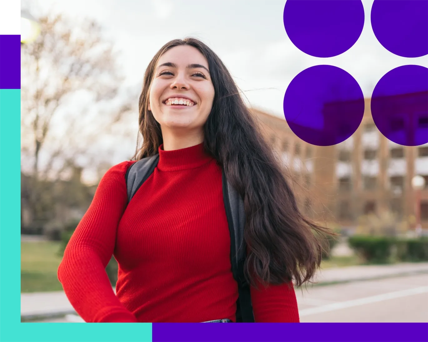 Young woman with a backpack smiling outdoors on a university campus.