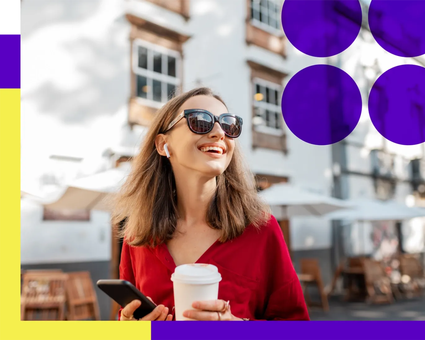 Young woman wearing sunglasses holding a coffee cup and smartphone