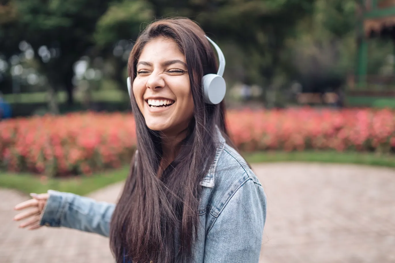 A girl grooving on music using while using headphones