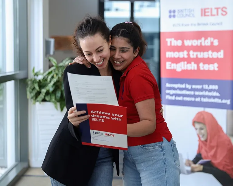 Students celebrating faster IELTS results