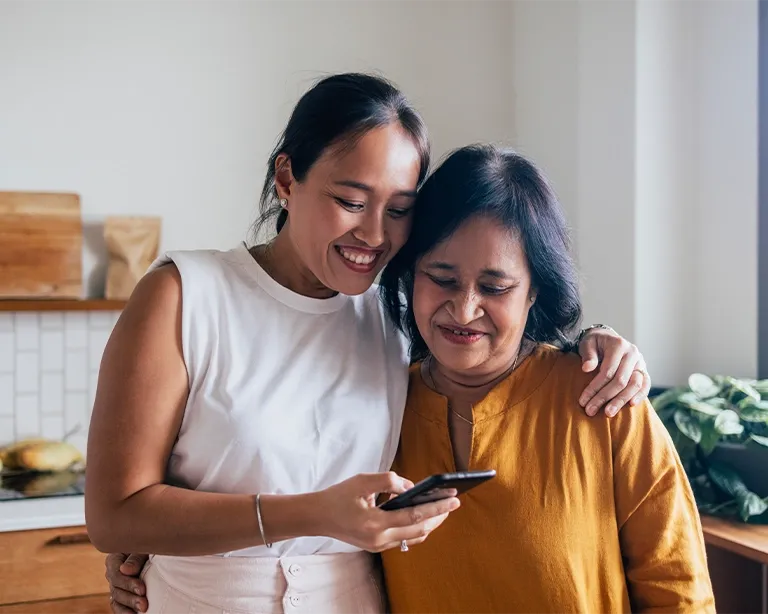 Mother and daughter checking IELTS information