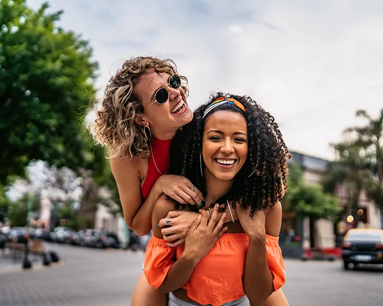 Group of friends enjoying time together on a city street.