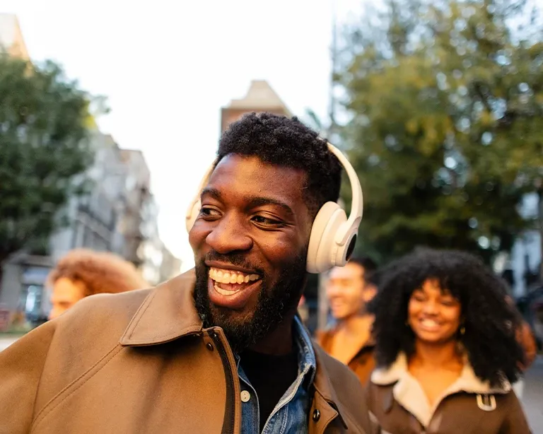 A man enjoying while listening to music on the streets