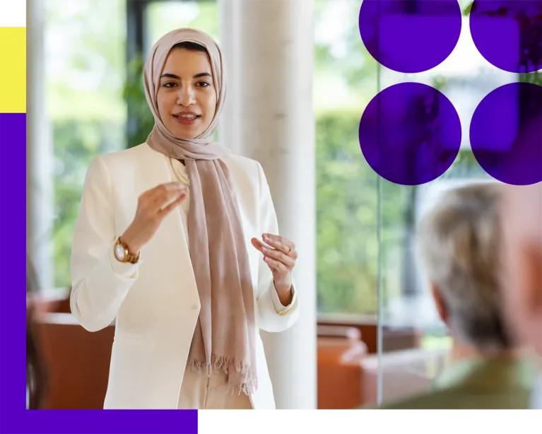 Woman giving an IELTS counseling or presentation session indoors.