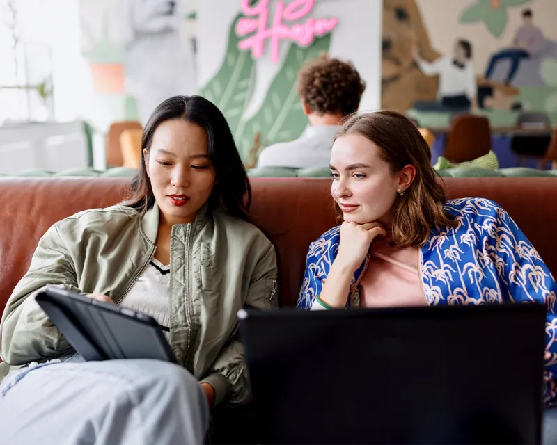 two-students-online-study-laptop-home